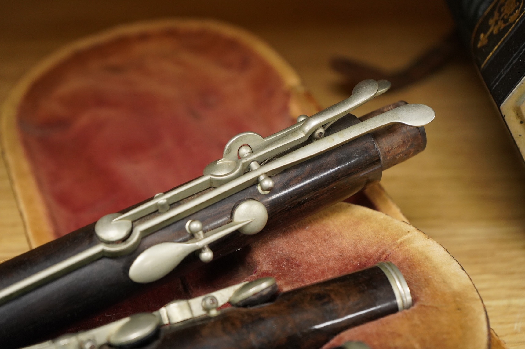 A 19th century cased ebony flute, with ten key system, unsigned, the case af